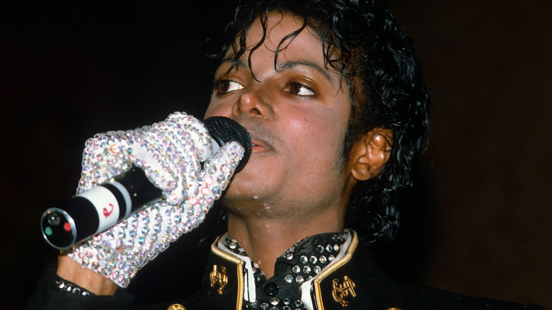 Michael Jackson holding microphone