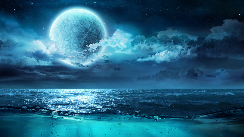 water world with moon in the night sky