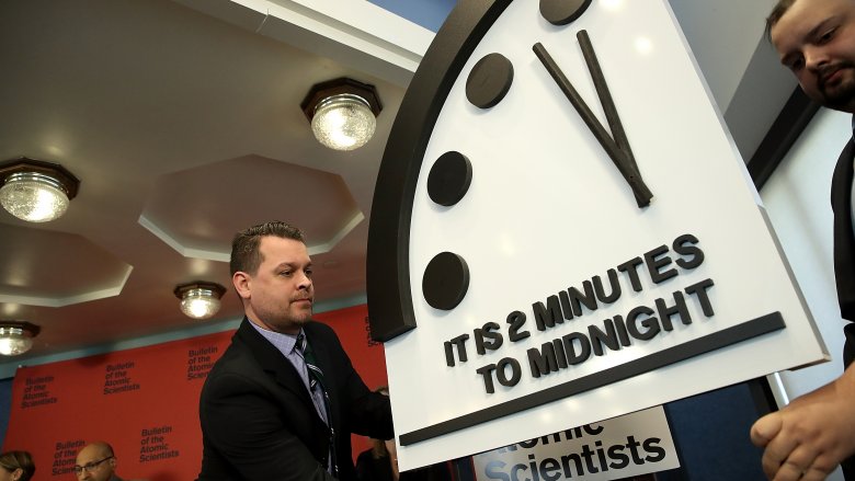 display of clock at two minutes to midnight