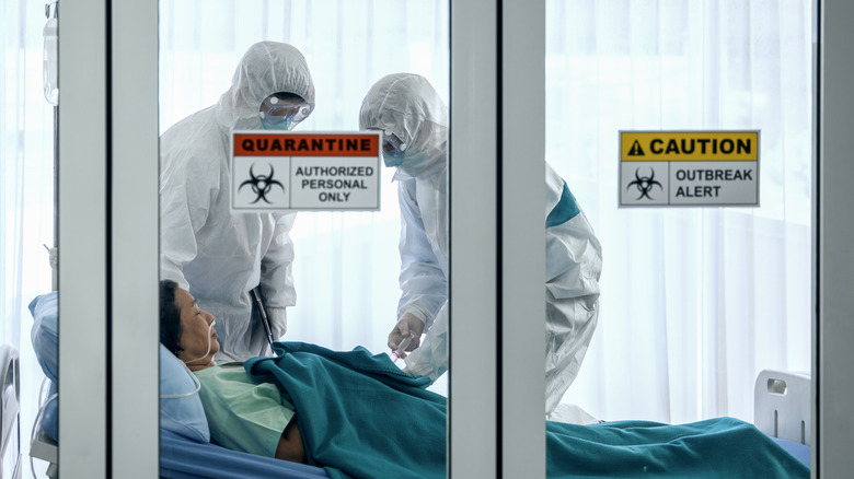 Hospital workers in quarantine room