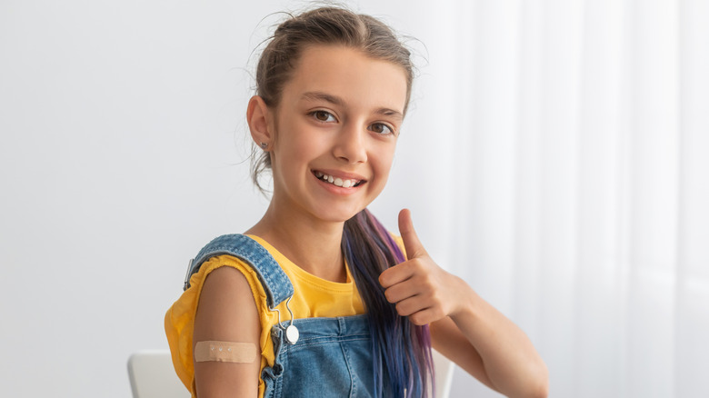 Thumbs up after receiving a vaccine