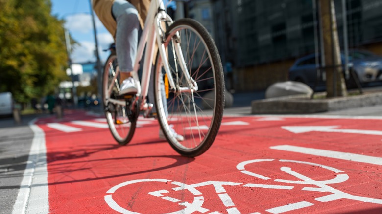 cyclist riding down street