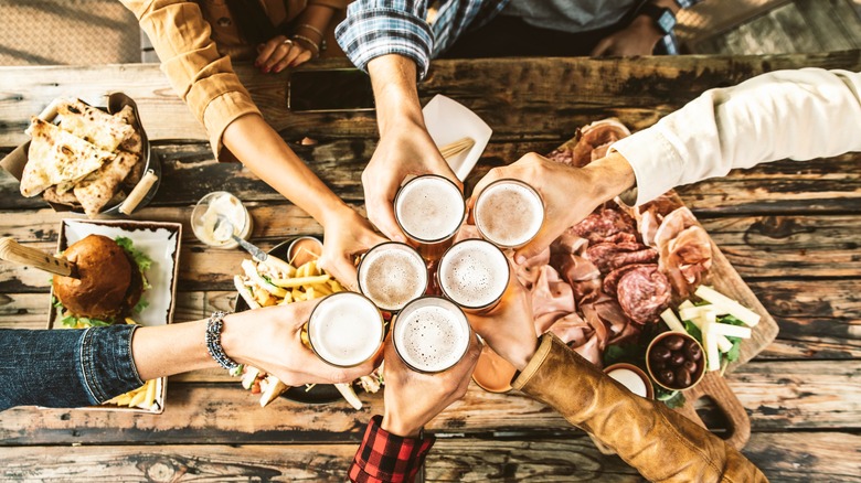 People cheersing with beers