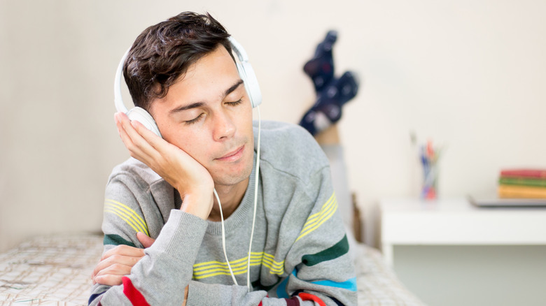 Young man listening to ASMR 