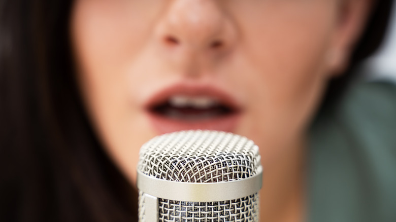 Woman recording on mic 