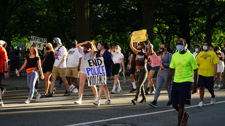 BLM protestors with placards in Lafayette Square