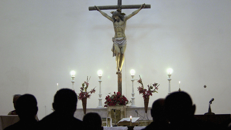 Church worshippers facing crucifix