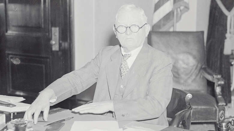 John Garner arranges his desk