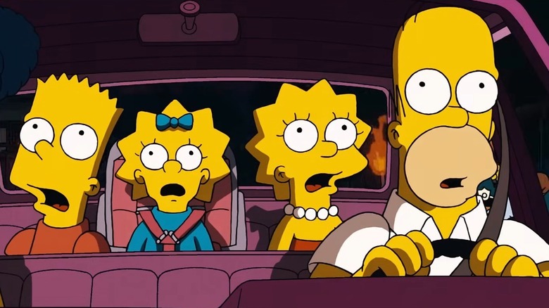 The Simpsons family in the car and looking up in shock in The Simpsons Movie