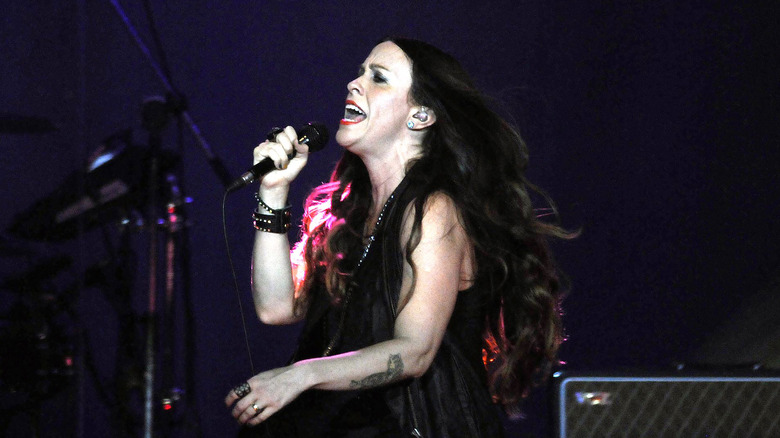 Alanis Morissette singing on stage