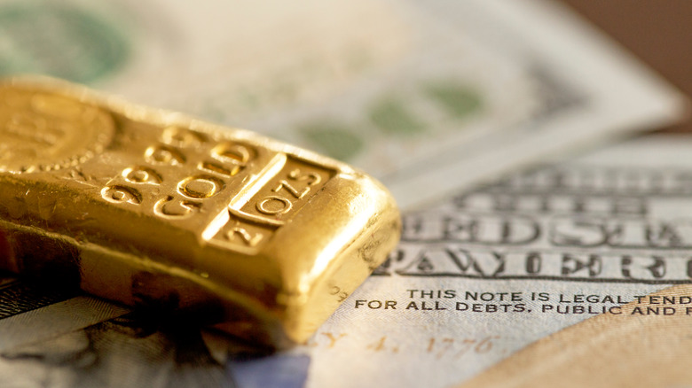 Gold bullion on dollar note