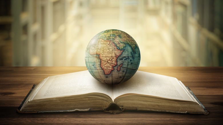 Globe on open book