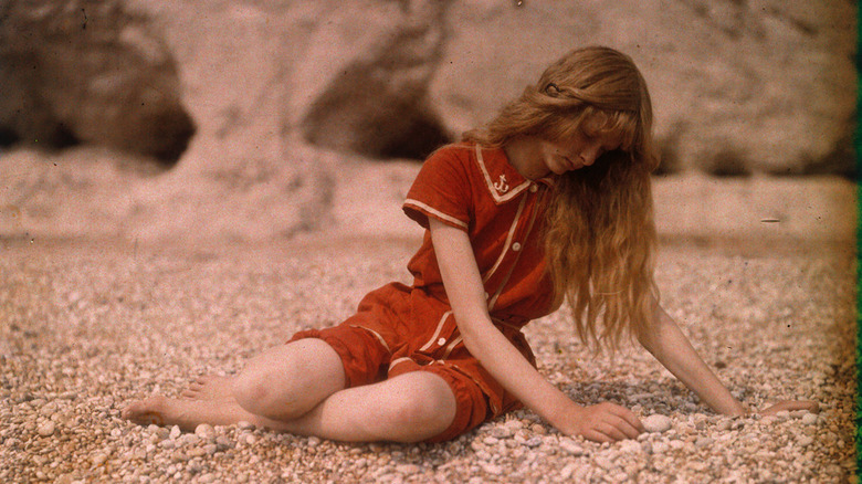 Woman red bathing suit on beach