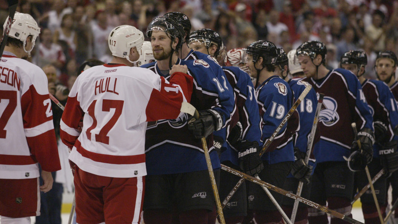 Red Wings and Avalanche shaking hands