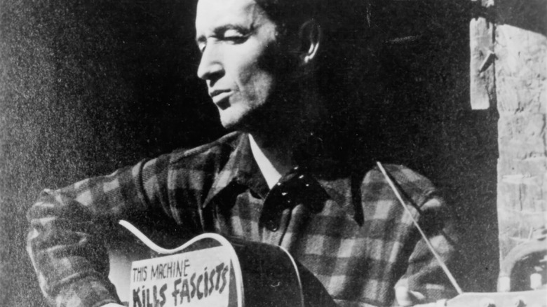 Woody Guthrie with another guitar