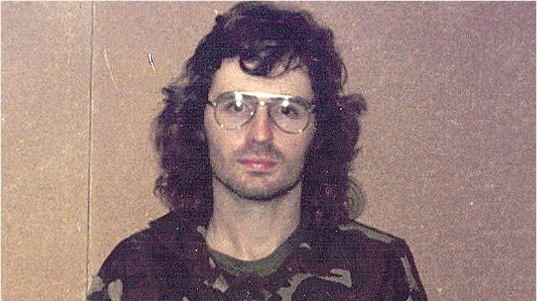 David Koresh camo shirt staring ahead