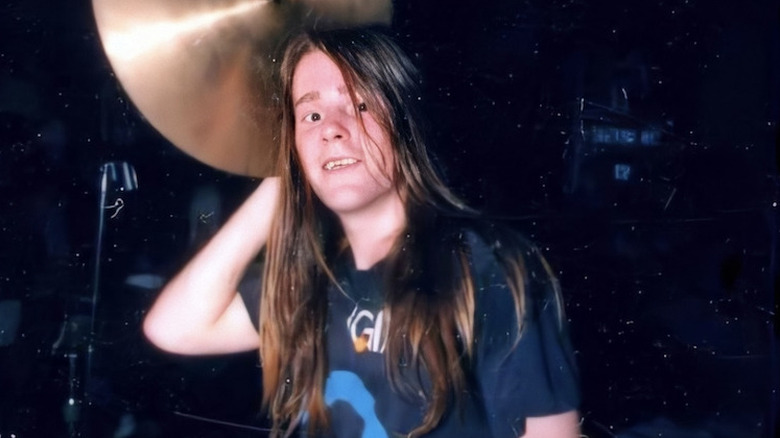 Chad Channing holding cymbal