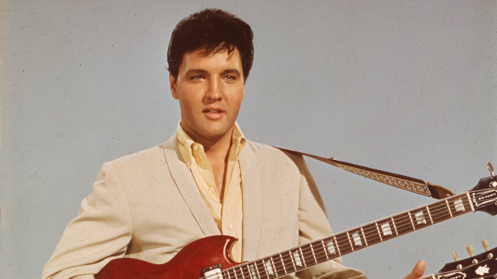 Elvis playing double-necked guitar