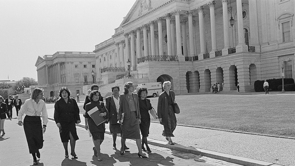 Nita Lowey, Pat Schroeder, Patsy Mink, Jolene Unsoeld, Eleanor Holmes Norton and Ileana Ros-Lehtinen walking by the U.S. Capitol on their way to the Senate