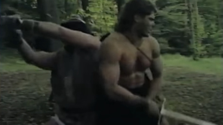 Mike Baab shirtless with sword