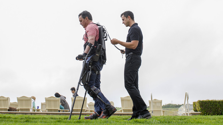 Injured person wearing an exoskeleton