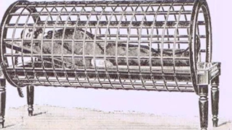 Drawing of an early 1900s electric heat cage with a man inside