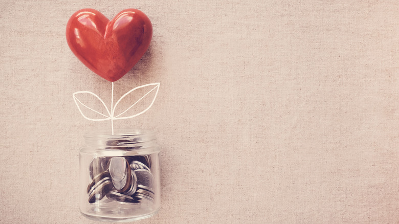 Coins in jar with heart