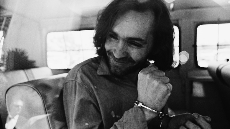 Charles Manson in handcuffs