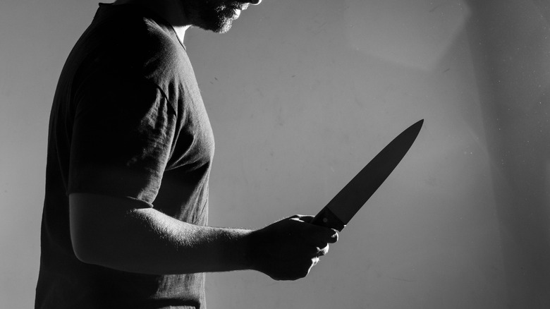 Man holding knife threateningly