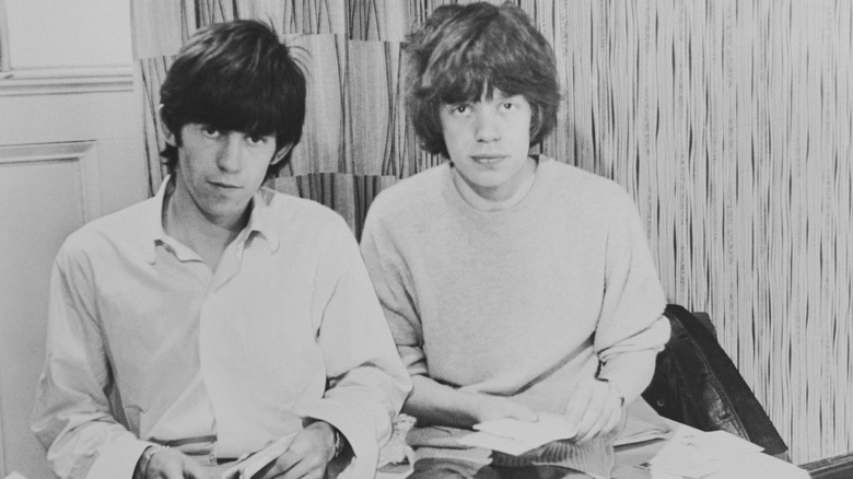 Keith Richards and Mick Jagger sitting