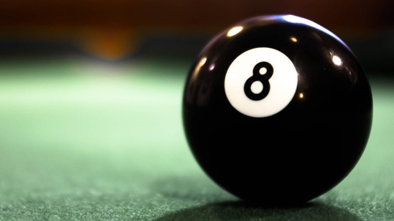 Eight ball on a billiard table