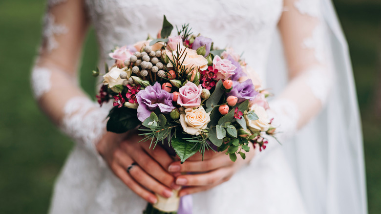 Bride holds a bouquet