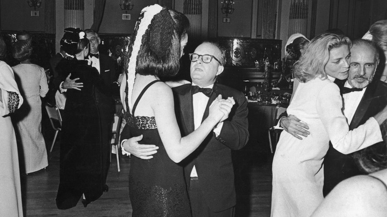 Capote dancing with taller woman