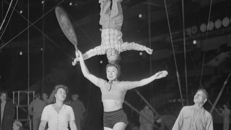 ringling bros acrobat balances on anothers head