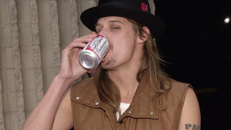 Kid Rock drinking a Budweiser