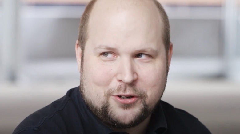 Markus Persson talking looking off