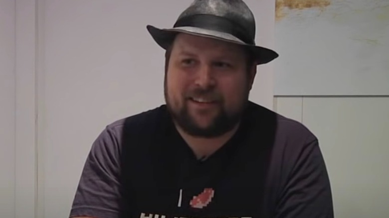 Markus Persson fedora smirking