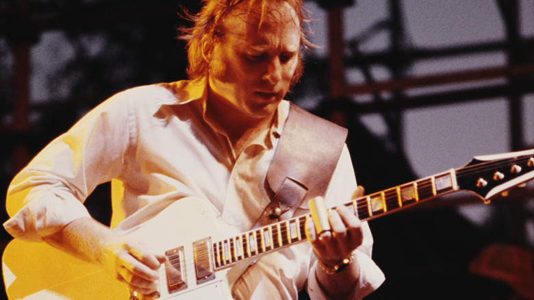 Stephen Stills strums his guitar