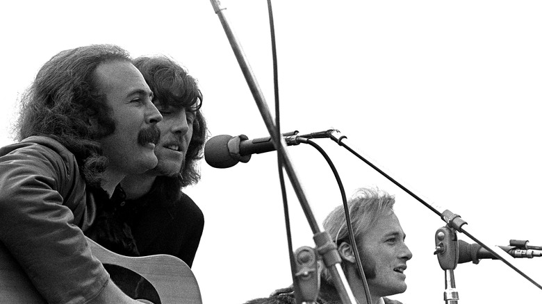 David Crosby, Stephen Stills, and Graham Nash performing