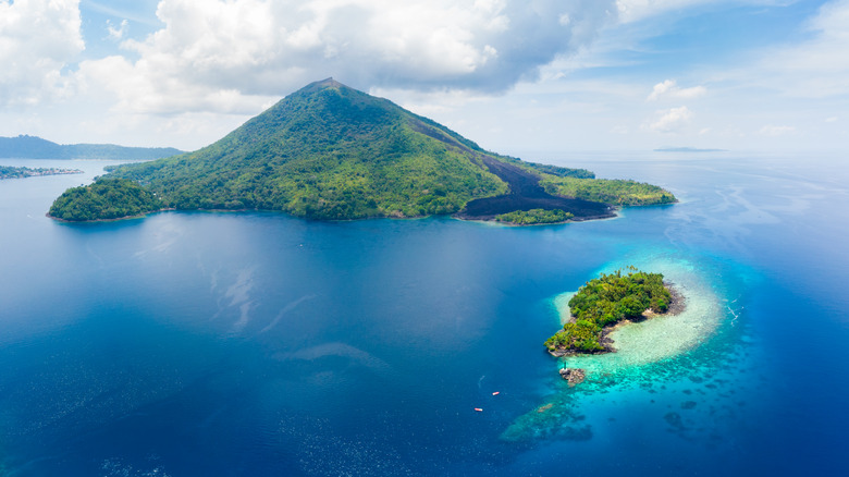 A volcanic island with black lava flows.