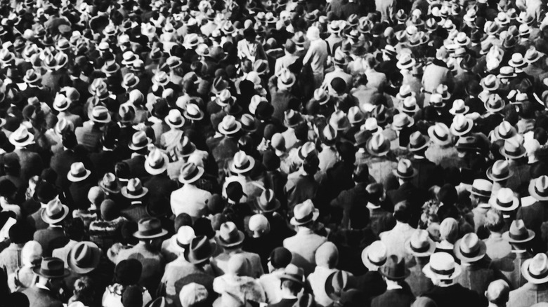 dense crowd wearing hats