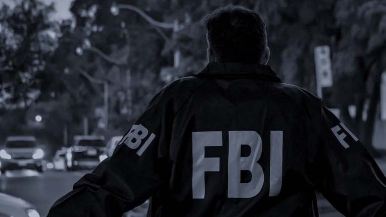 a federal agent wearing an FBI jacket