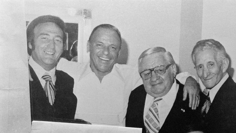 Mobsters pose with Frank Sinatra (second from left)