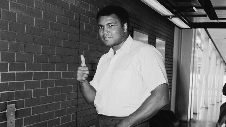 Muhammad Ali holding thumbs up