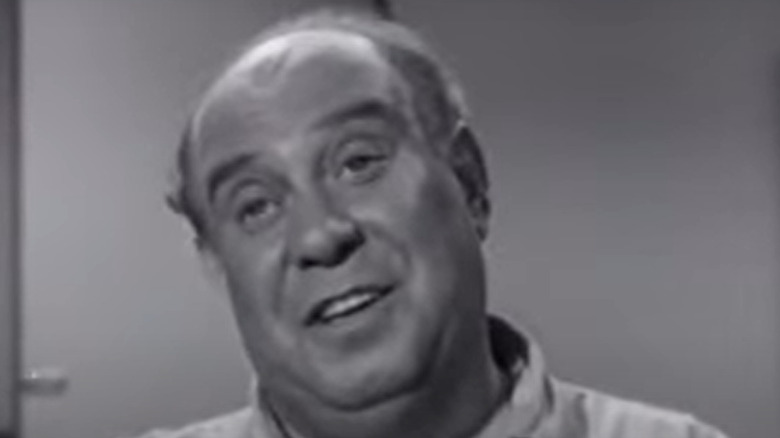 Joe Besser smiling on screen