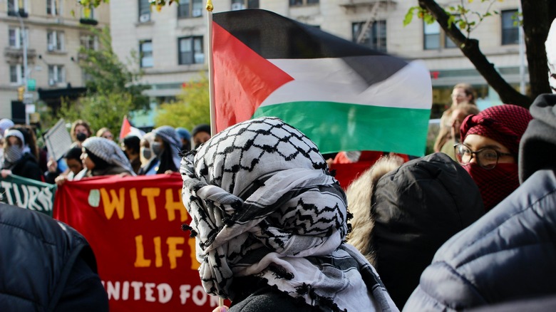 Columbia student holding Palestine flag