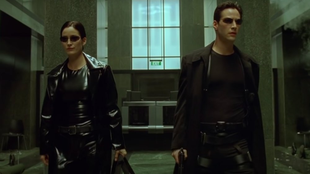 Carrie-Anne Moss as Trinity and Keanu Reeves as Neo in "The Matrix"