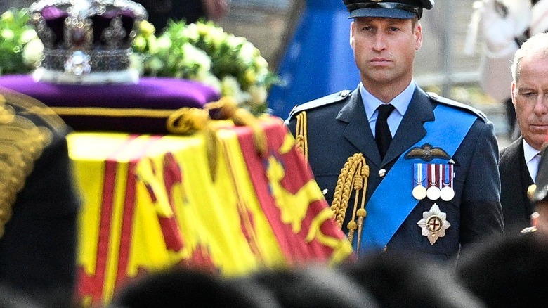 Prince William with queen's coffin