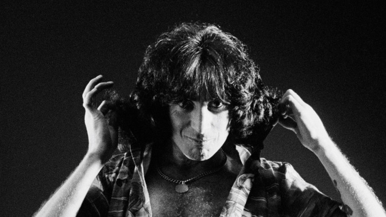 bon scott popping collar in publicity portrait