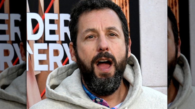 adam sandler beard hoodie talking at event